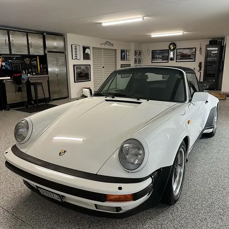 A White Porsche Is Parked In A Garage — Remedy Mobile Car Detailing in Burleigh, QLD