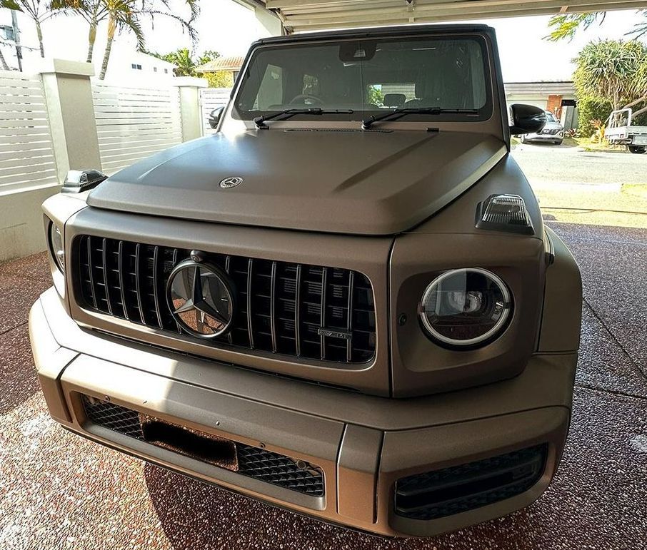 A Mercedes Benz G63 Is Parked Under A Garage Door — Remedy Mobile Car Detailing in Burleigh, QLD