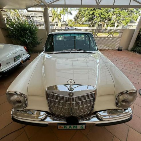 Mercedes-Benz 280E Parked Near a Building — Remedy Mobile Car Detailing in Burleigh, QLD