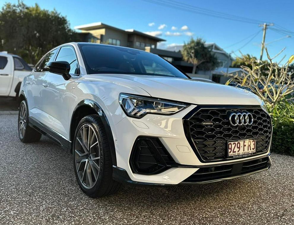 A White Audi Q3 Is Parked In A Driveway In Front Of A House — Remedy Mobile Car Detailing in Palm Beach, QLD