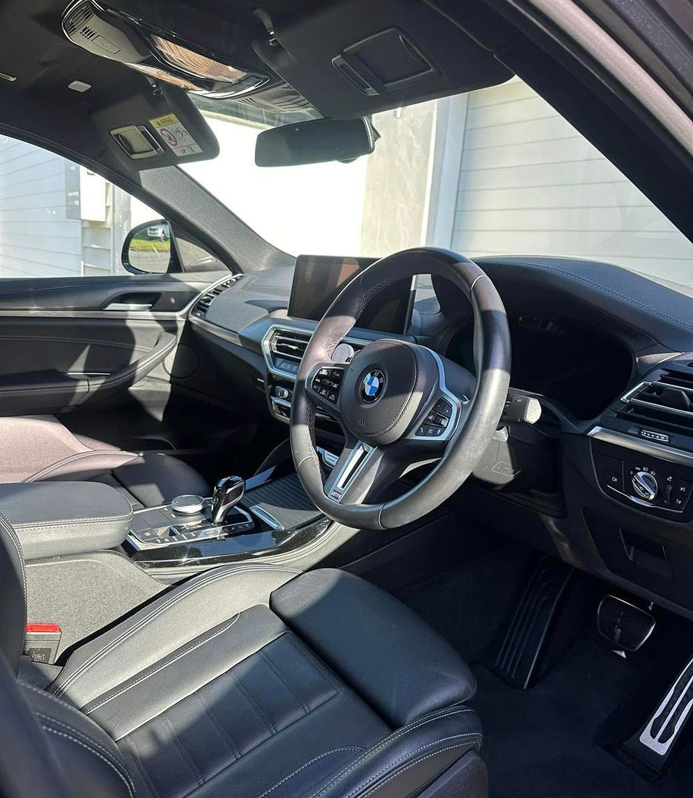 Interior View Of A Black Bmw Car With Leather Seats — Remedy Mobile Car Detailing in Palm Beach, QLD