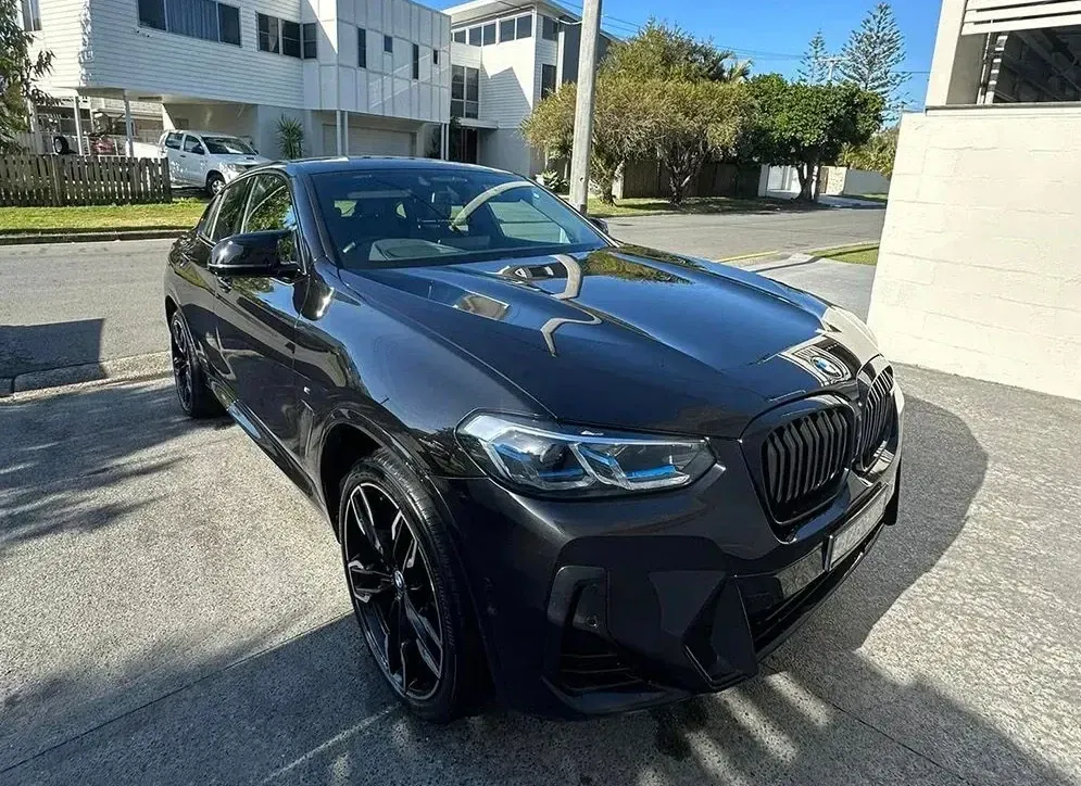 Dark Gray Bmw X4 Parked On A Paved Driveway — Remedy Mobile Car Detailing in Palm Beach, QLD