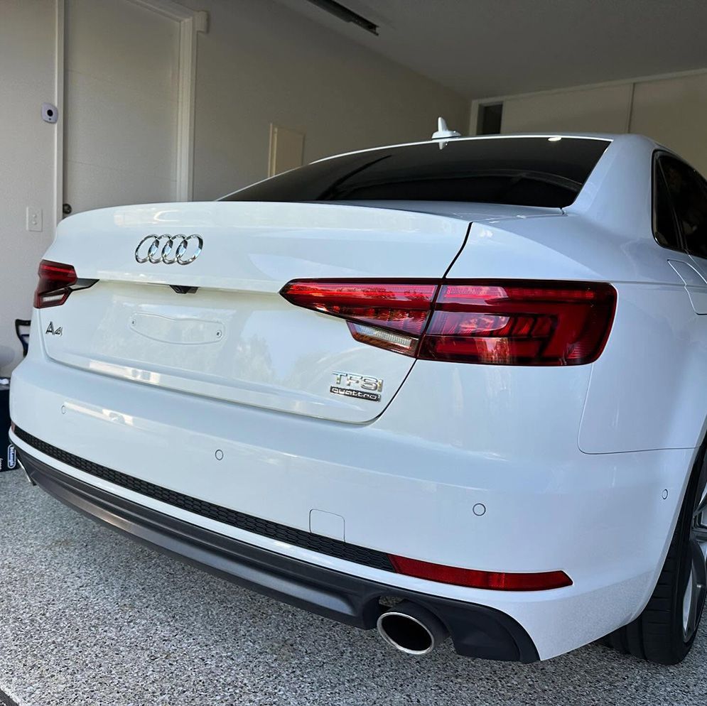 White Audi A4 Sedan Parked Inside A Garage — Remedy Mobile Car Detailing in Palm Beach, QLD