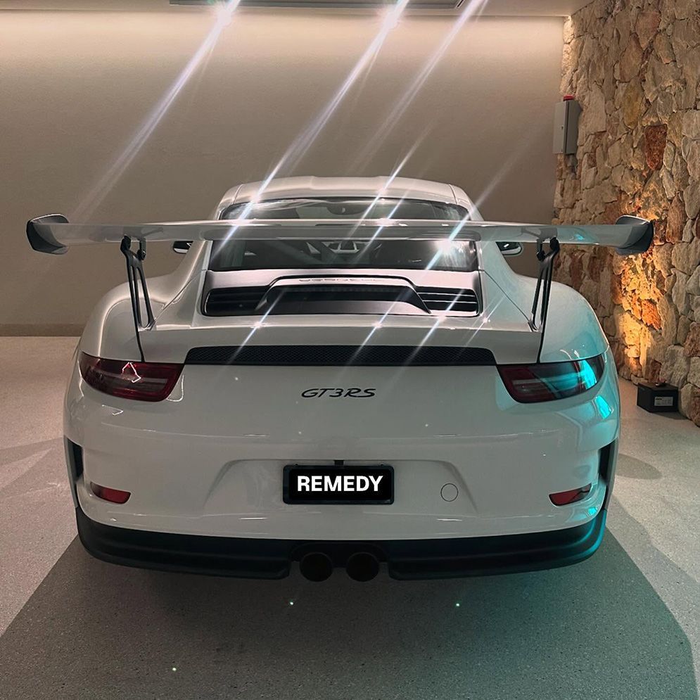 A White Sports Car With A License Plate That Says Remedy — Remedy Mobile Car Detailing in Currumbin, QLD