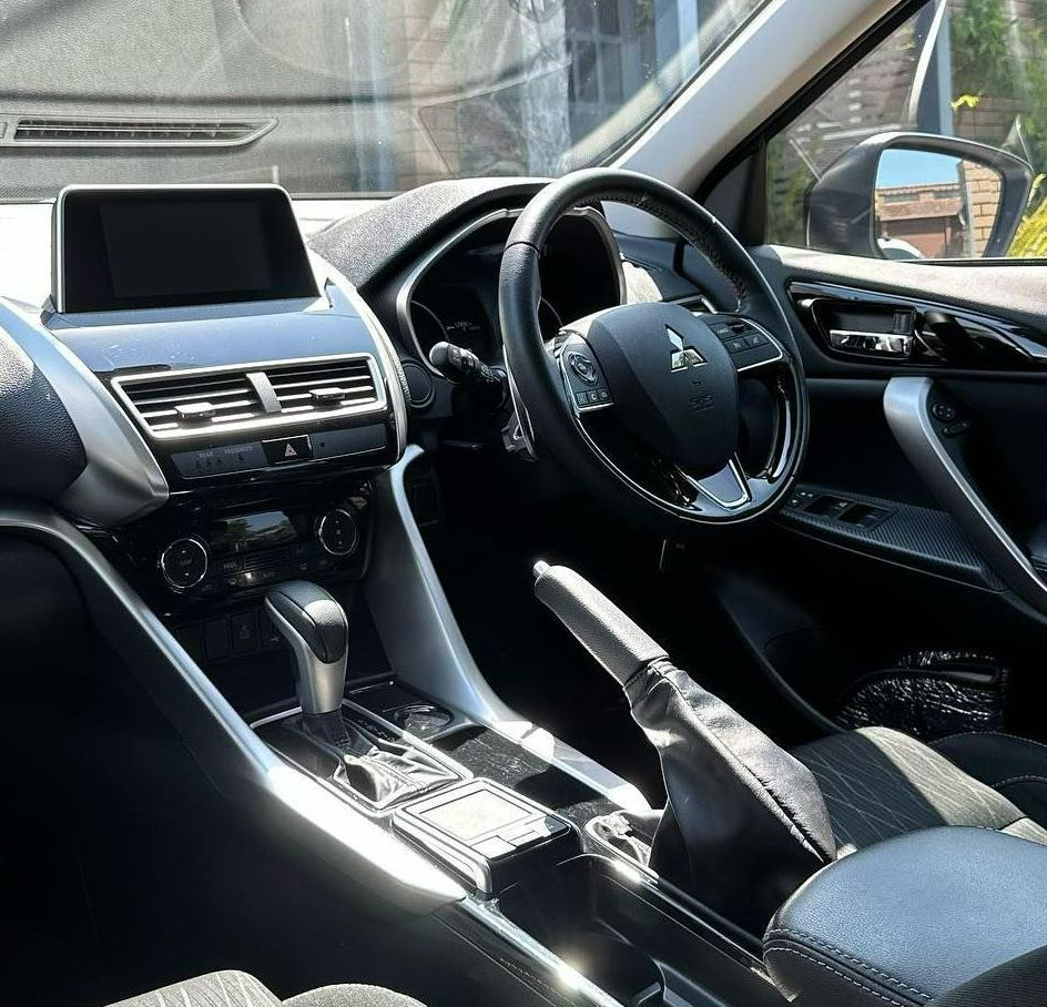 Interior Of A Mitsubishi Car With Black Steering Wheel — Remedy Mobile Car Detailing in Currumbin, QLD