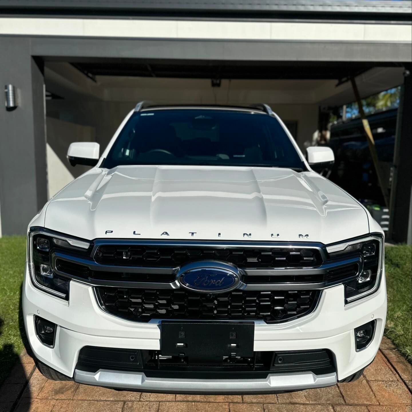 White Ford Everest Platinum Suv Parked In Front Of A Garage — Remedy Mobile Car Detailing in Currumbin, QLD