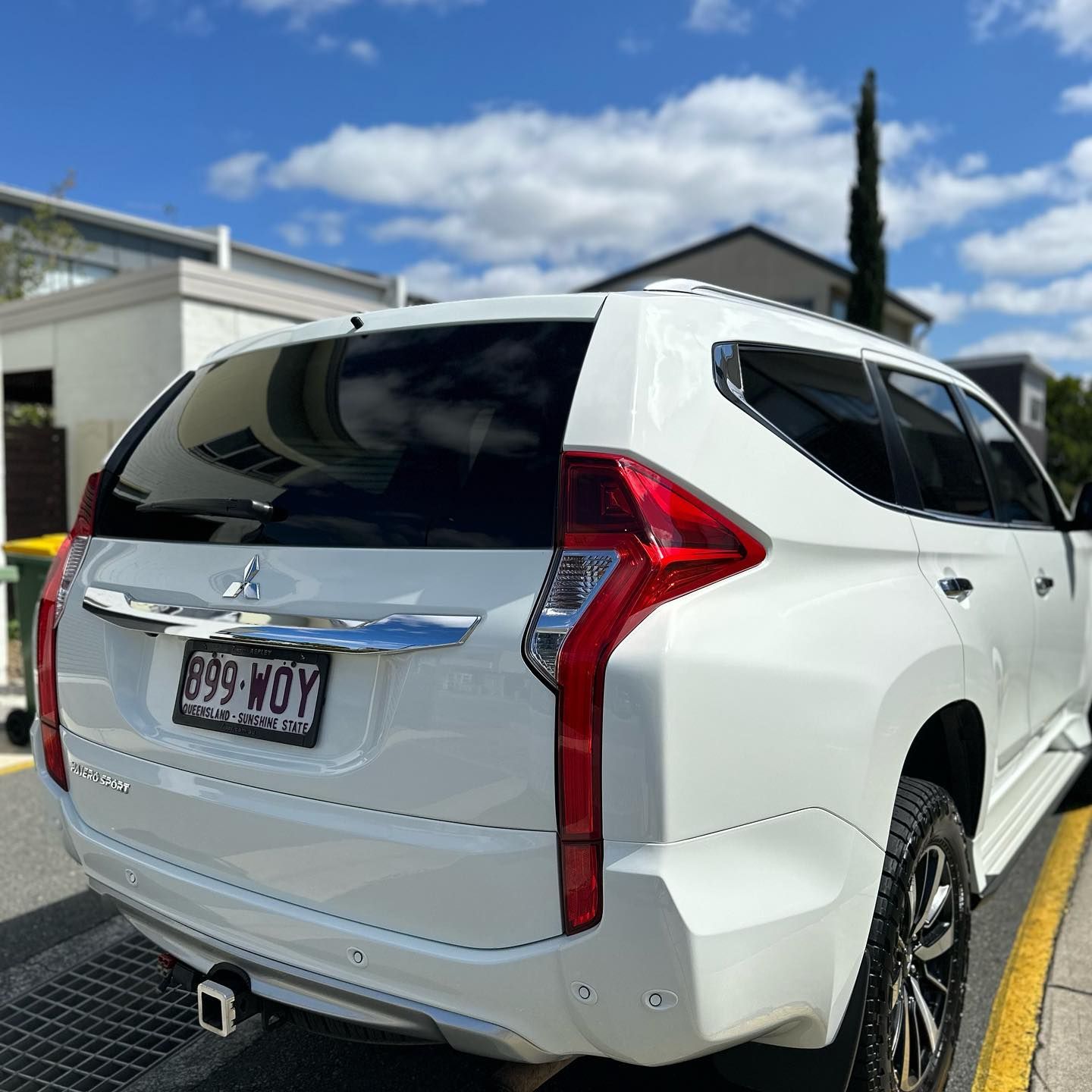 A White Suv Is Parked On The Side Of The Road — Remedy Mobile Car Detailing in Tweed Heads, NSW
