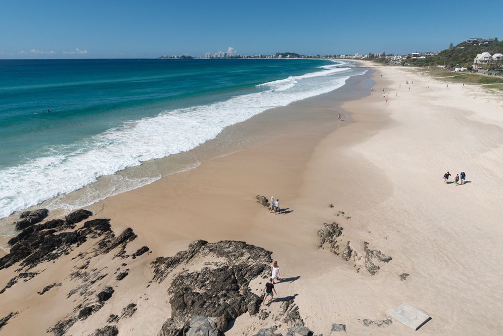An Aerial View Of A Beach With Waves Crashing On The Shore — Remedy Mobile Car Detailing in Currumbin, QLD