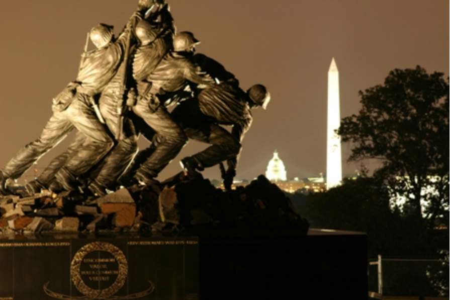 Marine Corps War Memorial with Washington Monument and Capitol Building in the background.