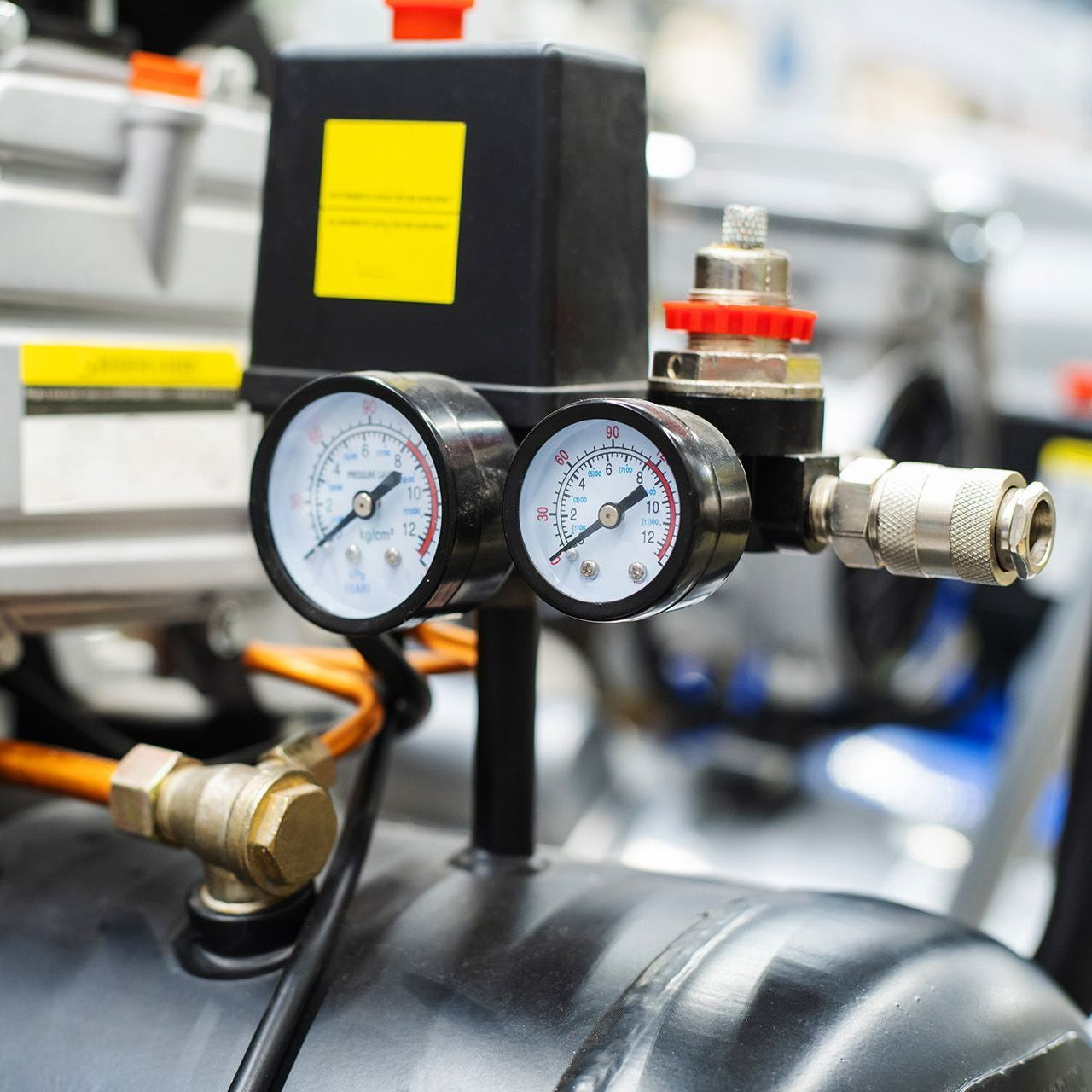 A close up of a pressure gauge on a machine.