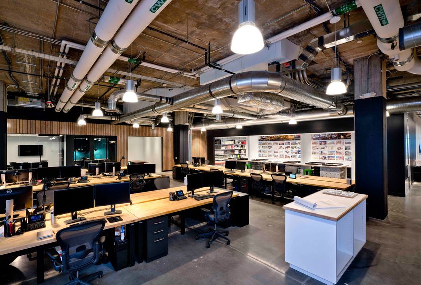 A large office with a lot of desks and chairs