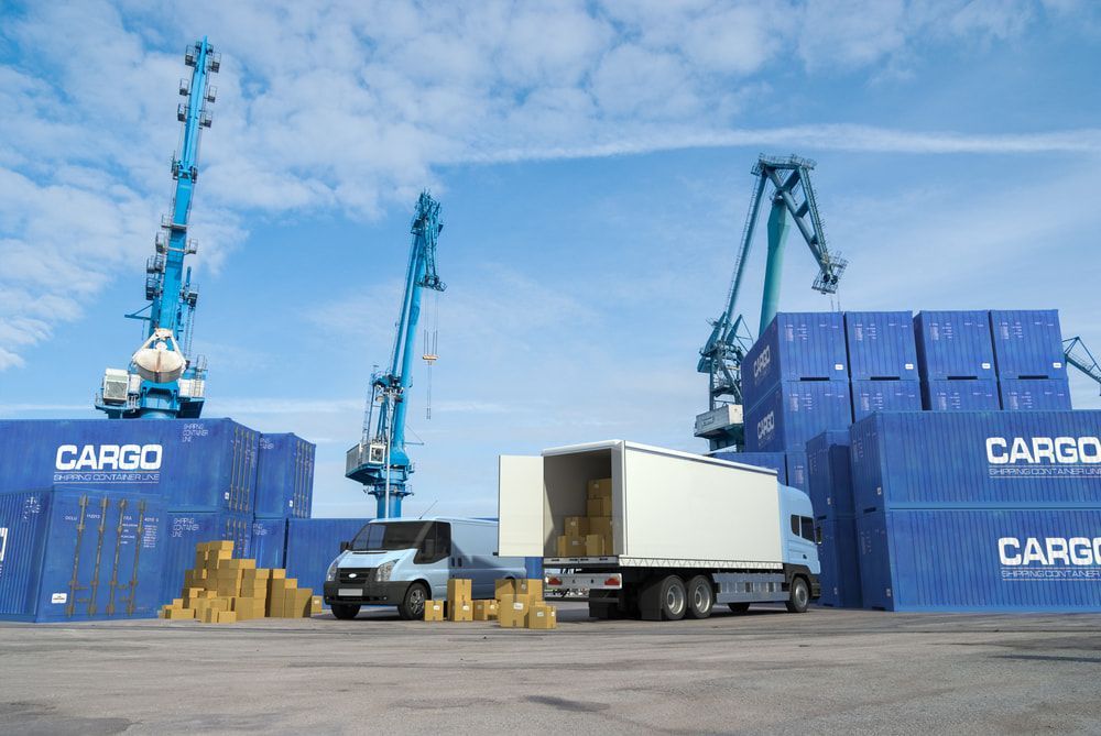 A Truck And A Van Are Parked In Front Of Cargo Containers — Removalists In Tweed Heads