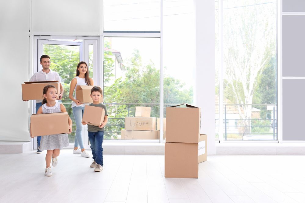 Happy Family Moving House — Removalists In Tweed Heads