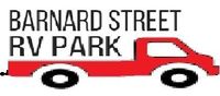 A red truck with the words barnard street rv park written on it.