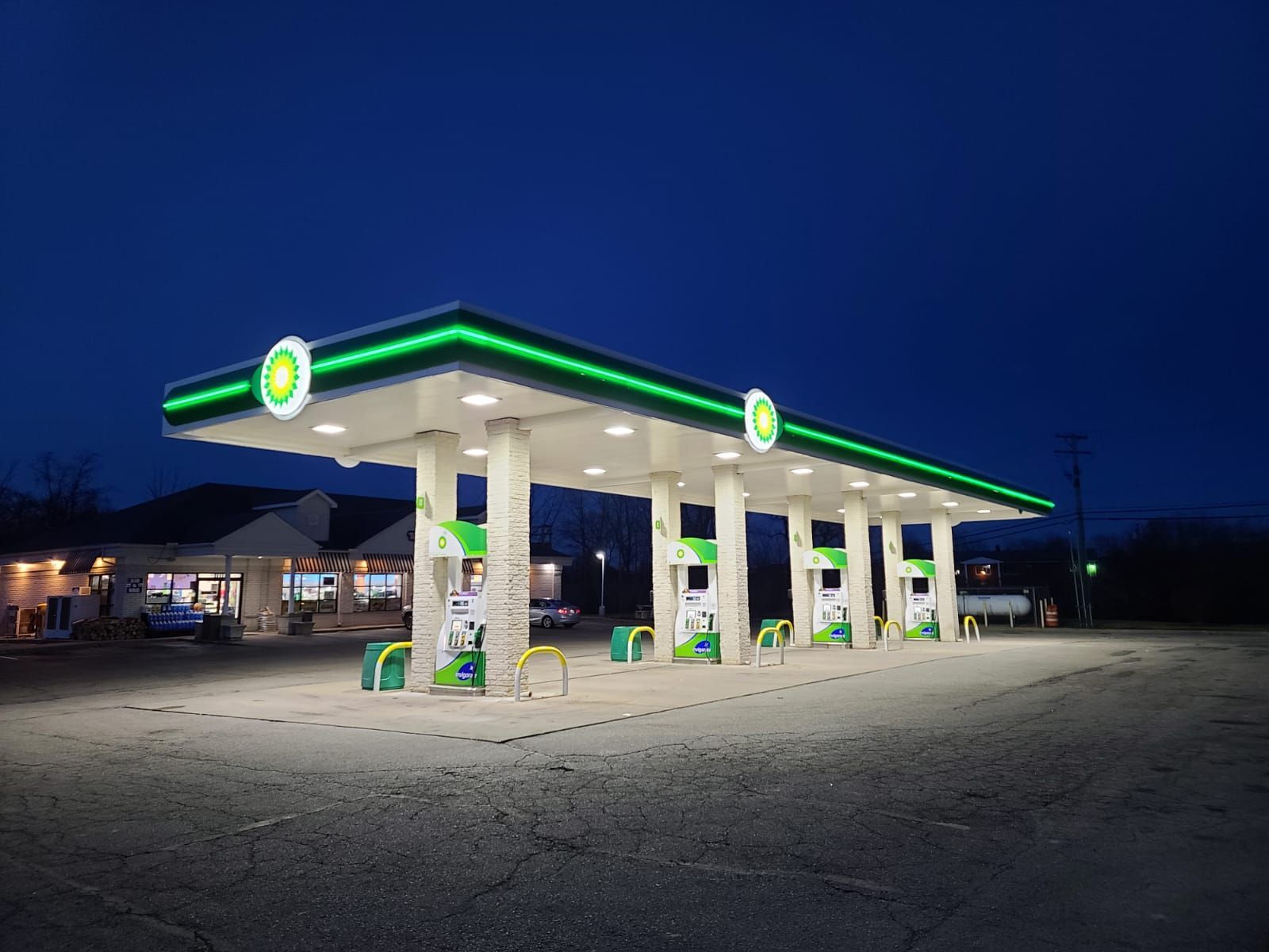 A bp gas station is lit up at night