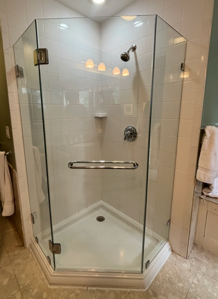 Frameless neo-angle corner shower installed on the South Shore