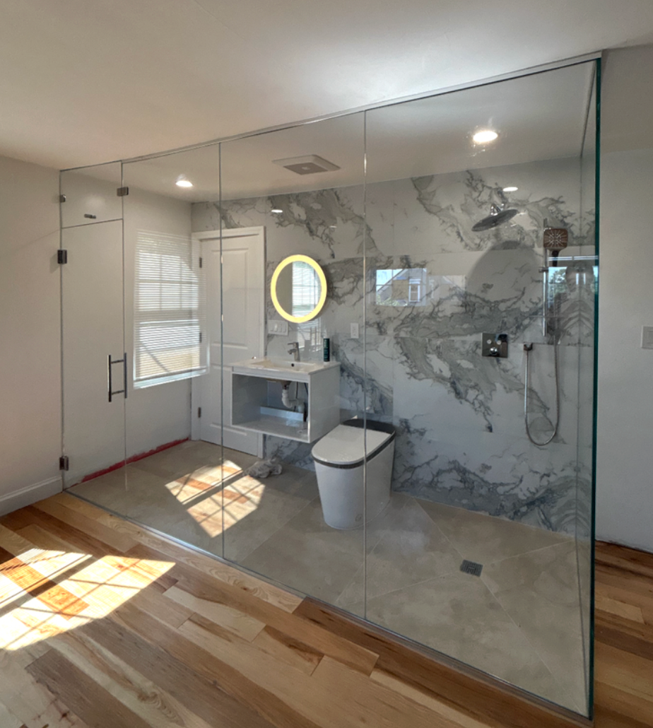 Glass shower enclosures in a modern Massachusetts bathroom