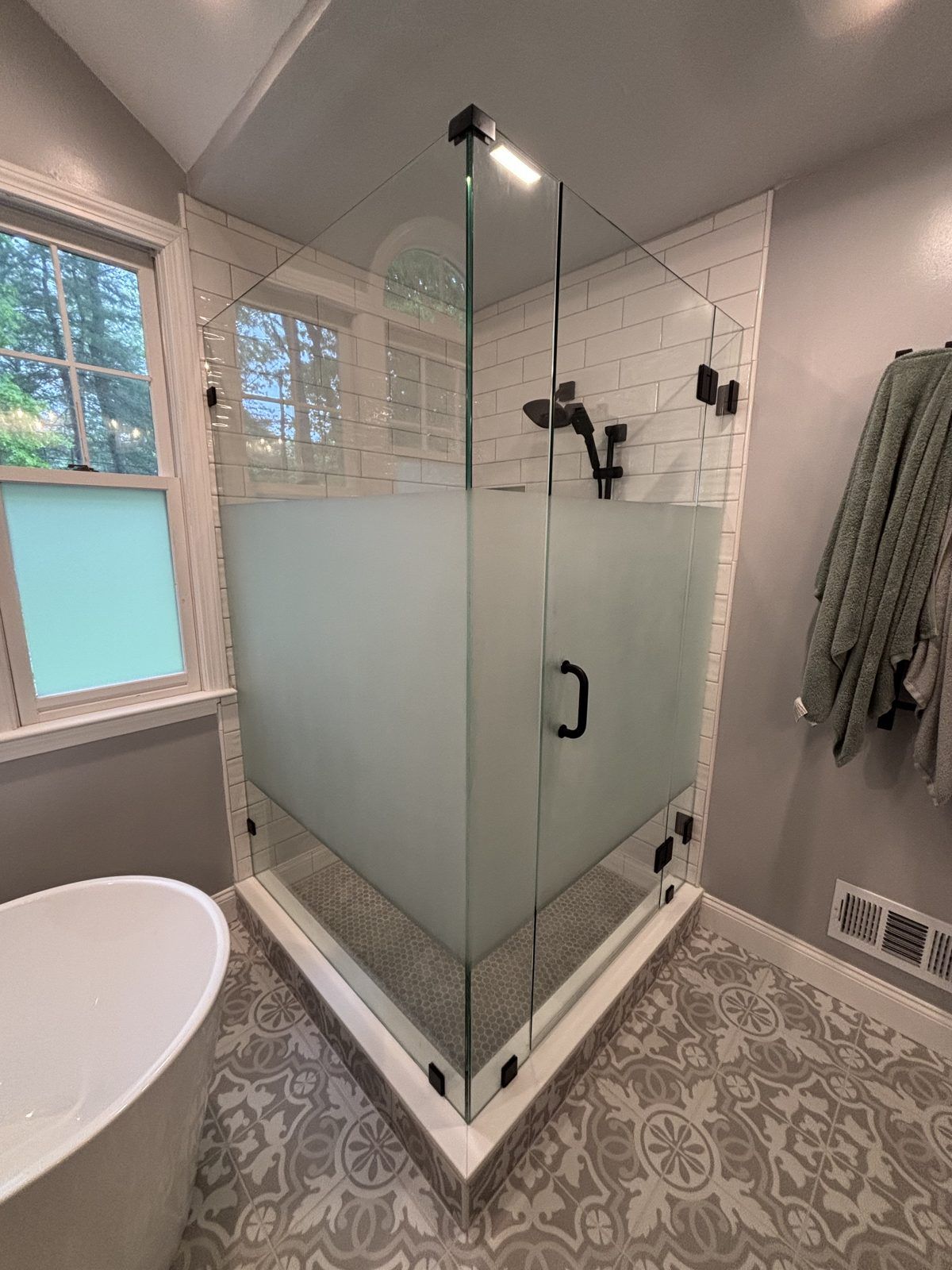 Frameless corner shower with frosted privacy glass and matte black hardware, Weston, MA