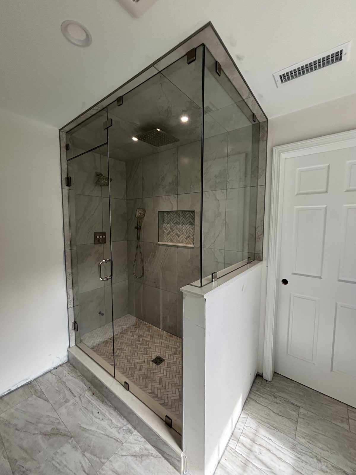 Frameless steam shower enclosure on a tiled knee wall, Newton, MA