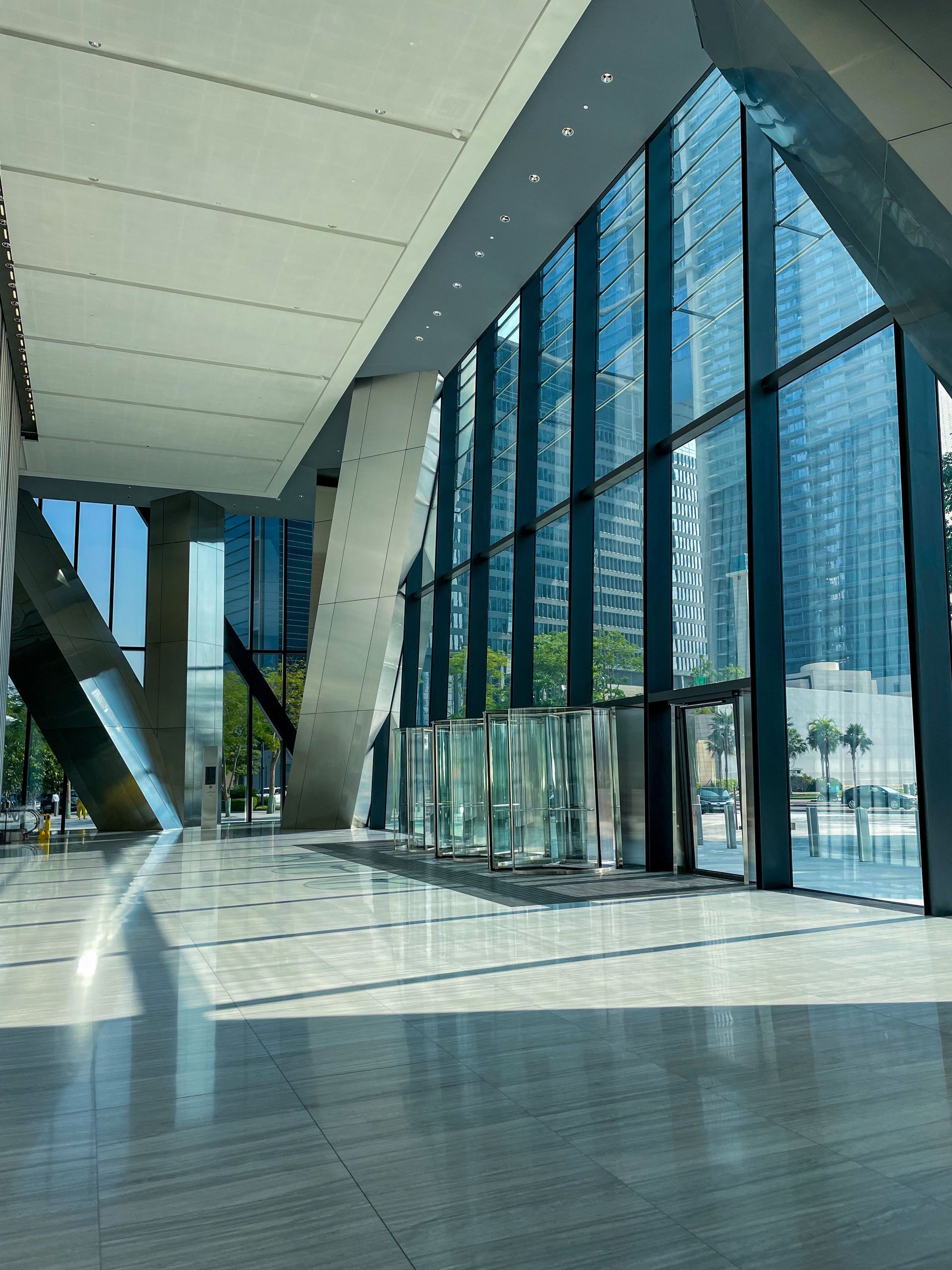 Glass curtain wall and entrance doors in a commercial building lobby