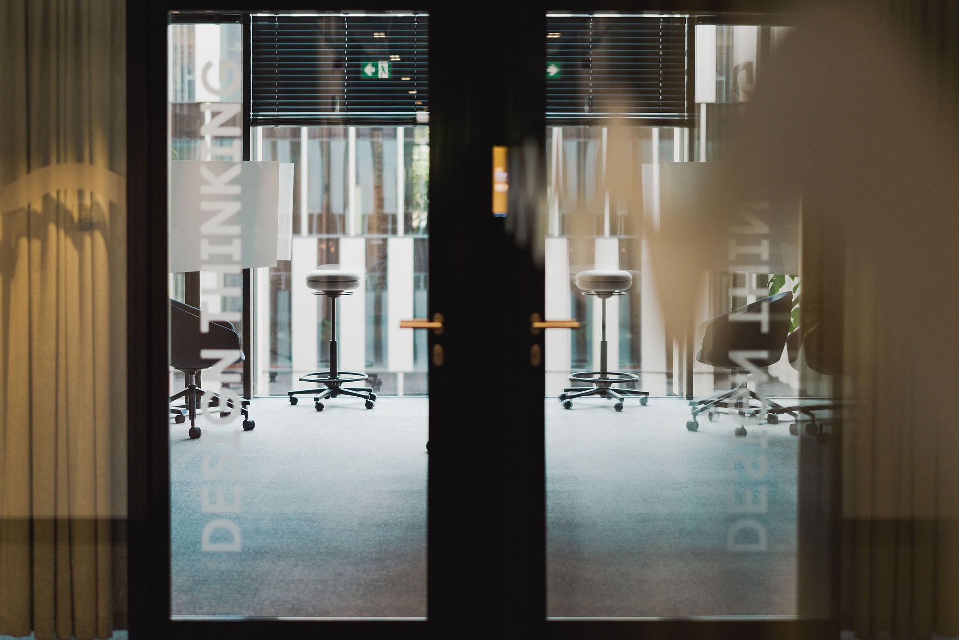 Frosted glass double doors at a commercial office entrance