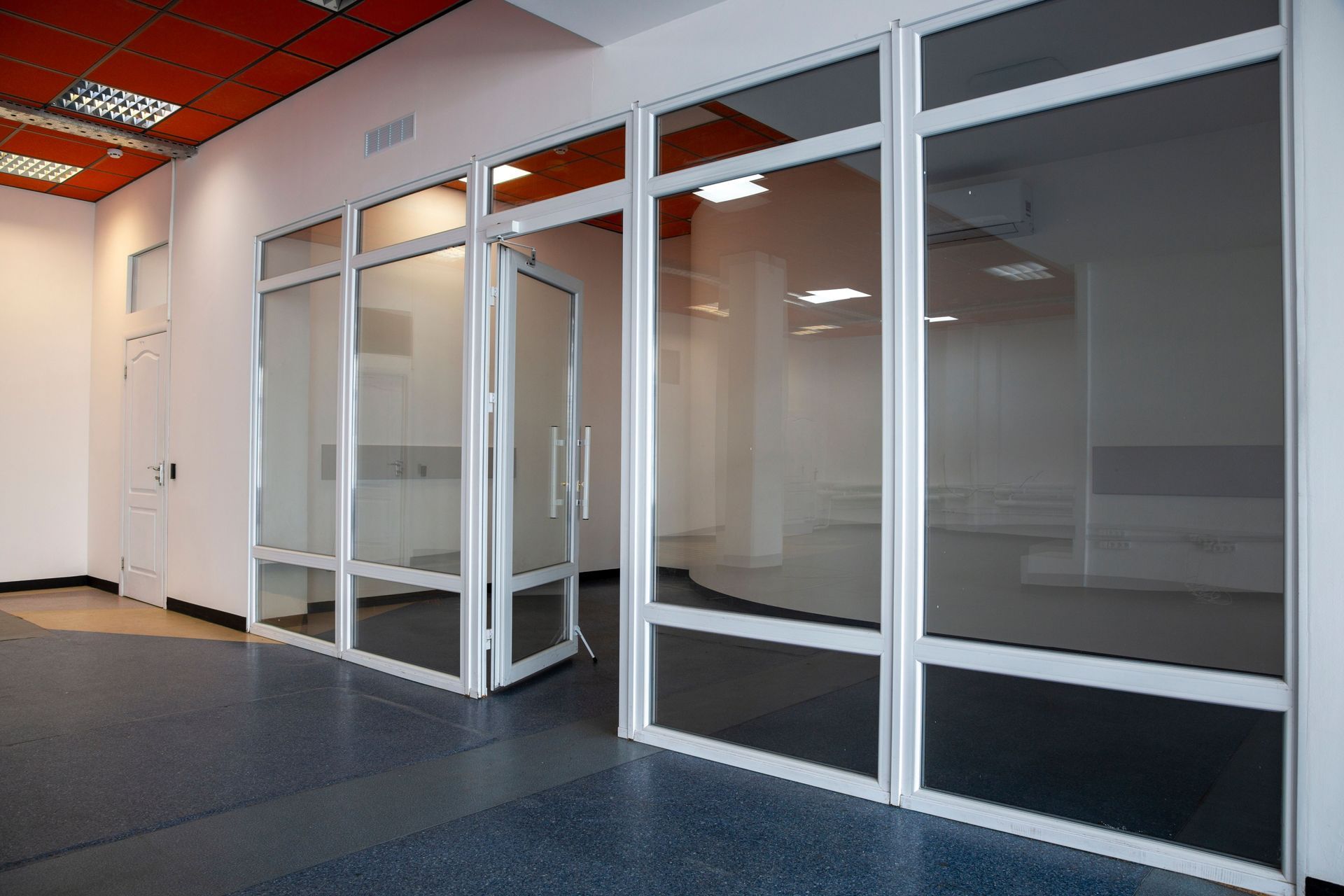 Glass office entry doors and interior glass partitions