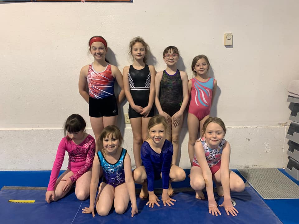 girls doing handstands at gymnastics center