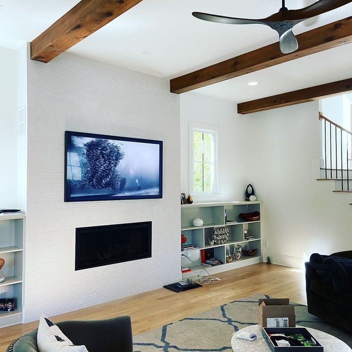 3Cs Audio Visual LLC | living room with a flat screen tv on the wall