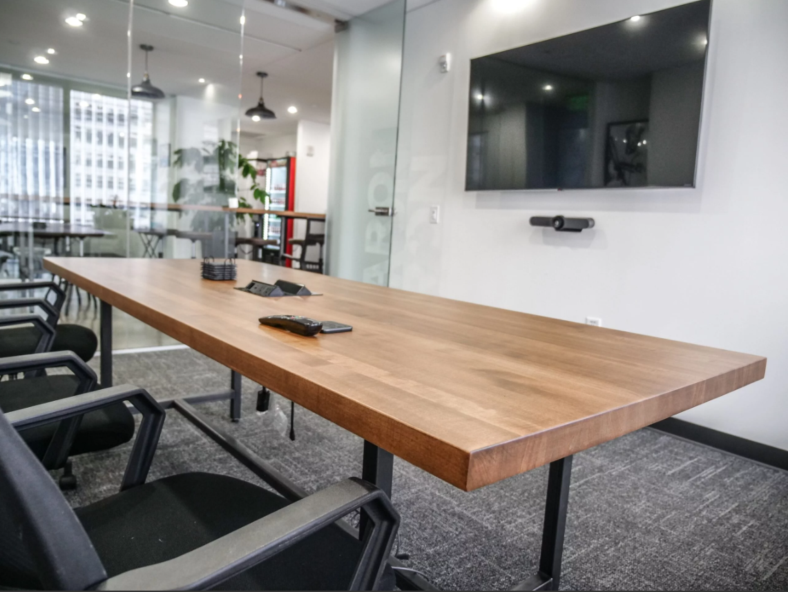 3Cs Audio-Visuals LLC | Commercial TV mounting with conference room AV setup and wall-mounted soundbar

