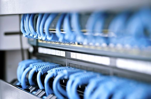 3Cs Audio Visual LLC | bunch of blue ethernet cables are connected to a server