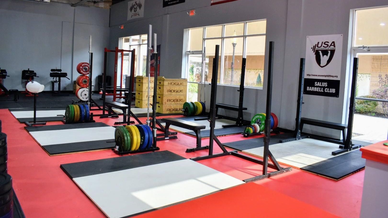 Weightlifting gym with lifting platforms, barbells, weights, and equipment at the best gym in Middletown, NJ