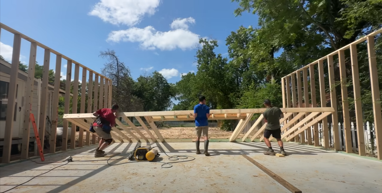 More wall frames are raised during garage building