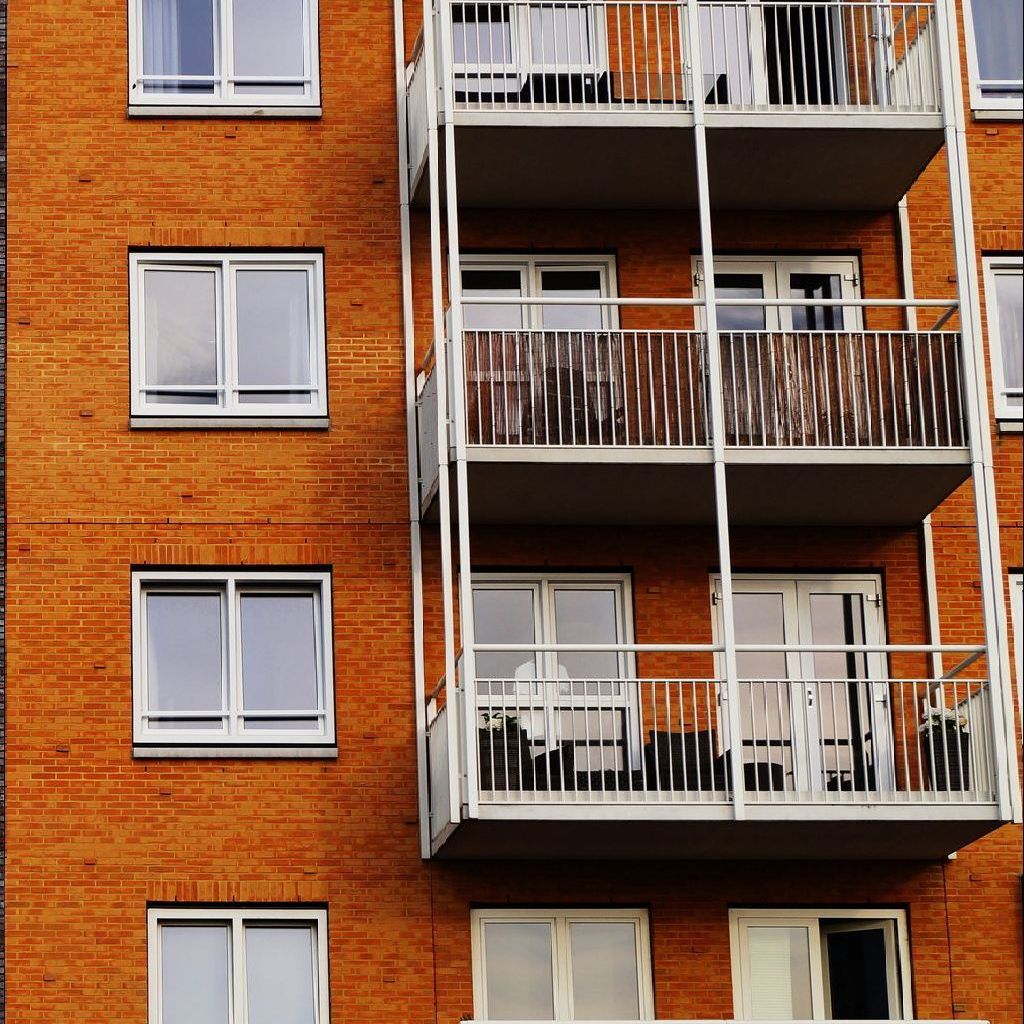 Brick building a brick building with a lot of windows and balconies
