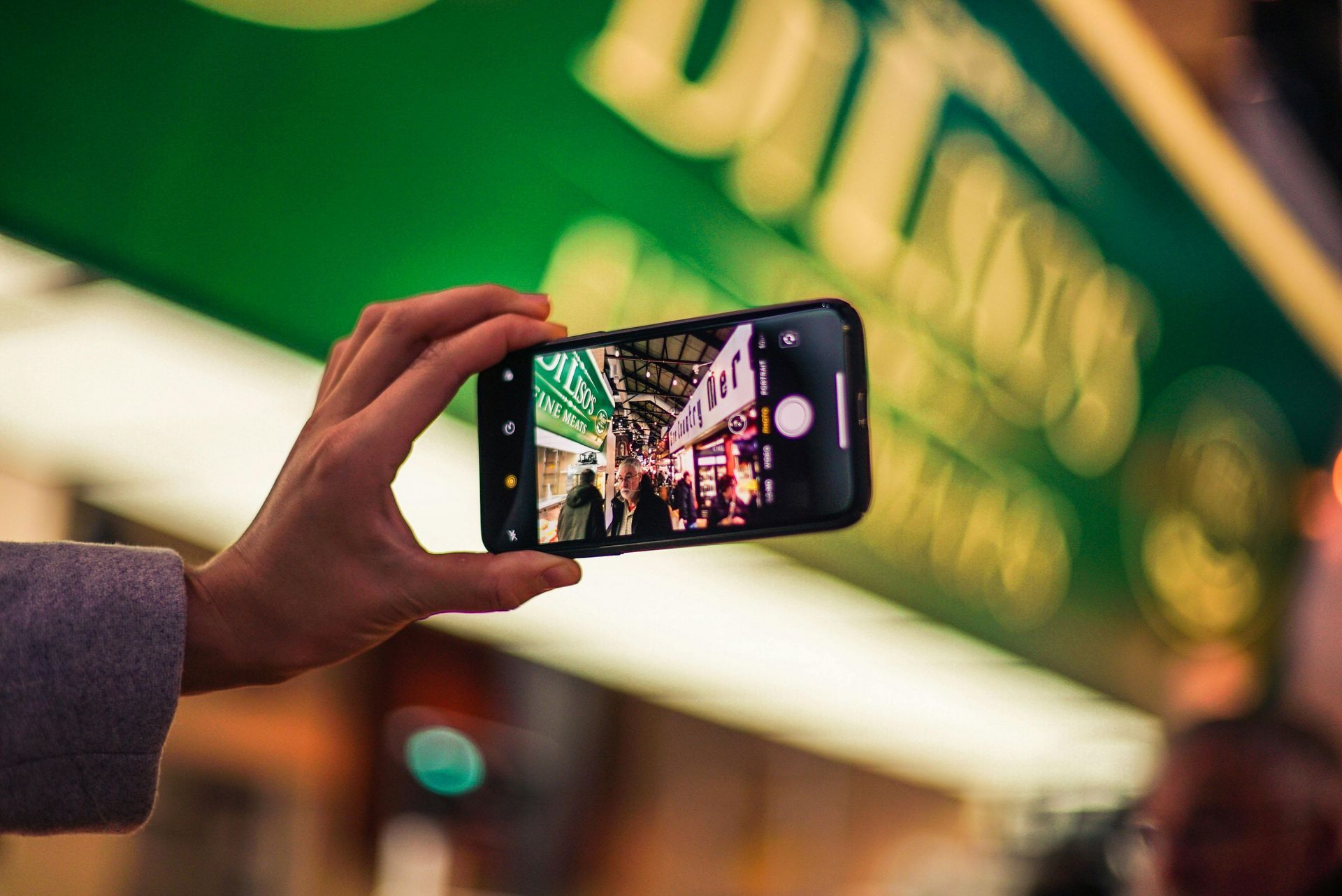 A person is taking a picture with a cell phone.