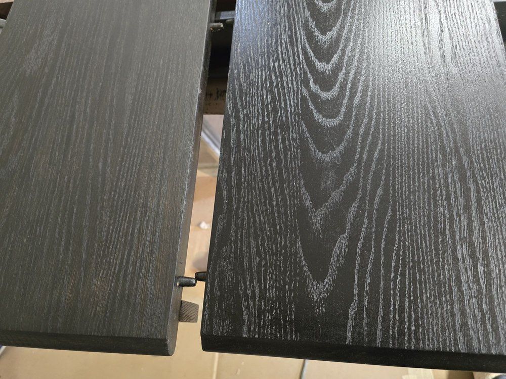 Two dark wood tabletop panels with a narrow gap between them