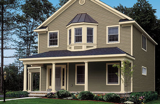 a house with a large porch and a blue roof