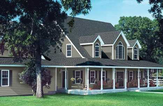 a large house with a porch and a lot of windows