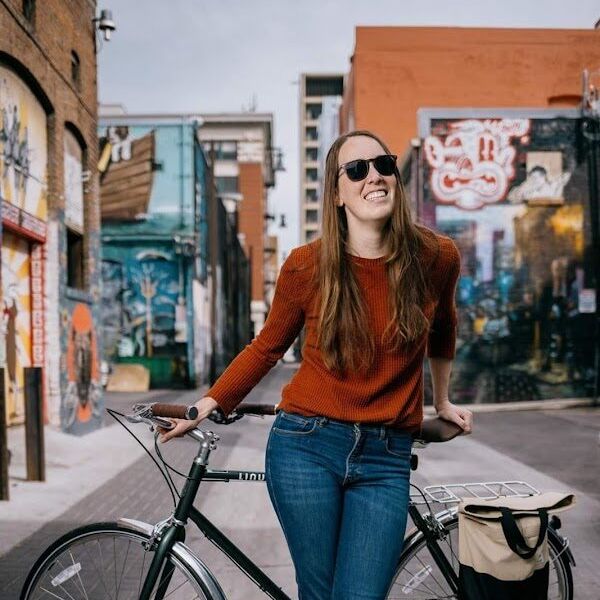 Staff member wearing sunglasses near a building