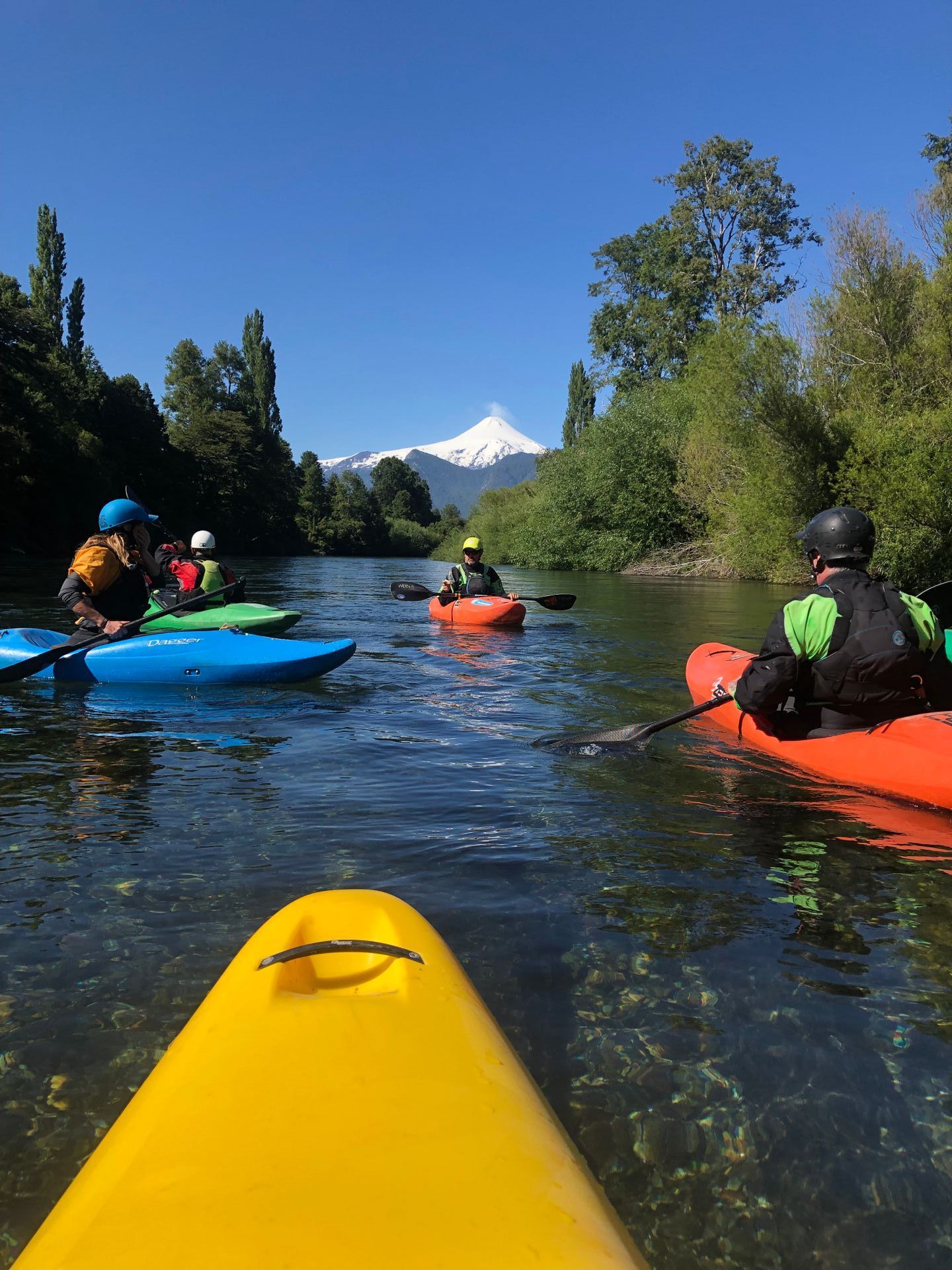 Kayakers in flatwater in Chile.
