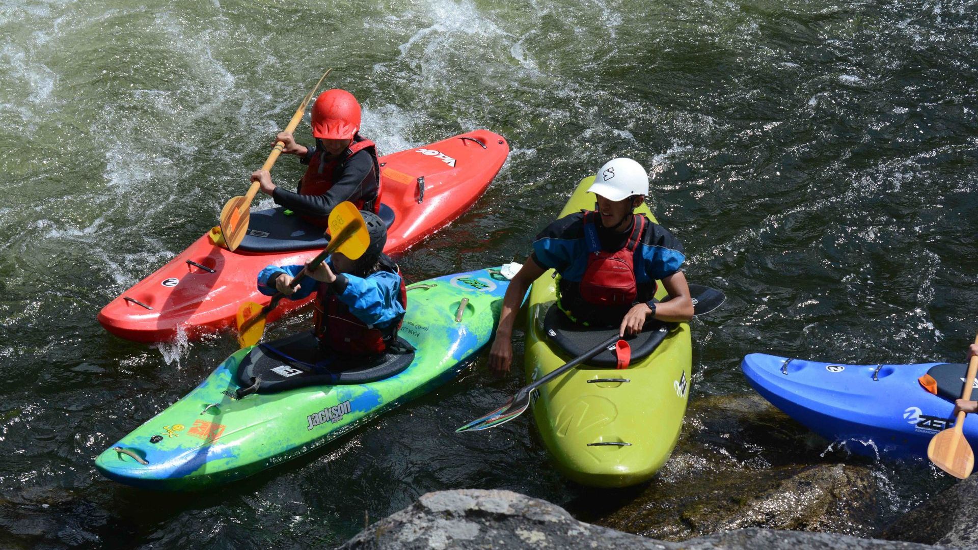 Group of whitewater kayaking students and instructors at Cascade Kayak School near Boise, Idaho