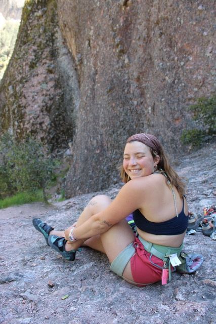 Person climbing a steep rock face