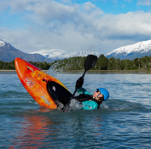 Kayak and paddle beside a mountain lake