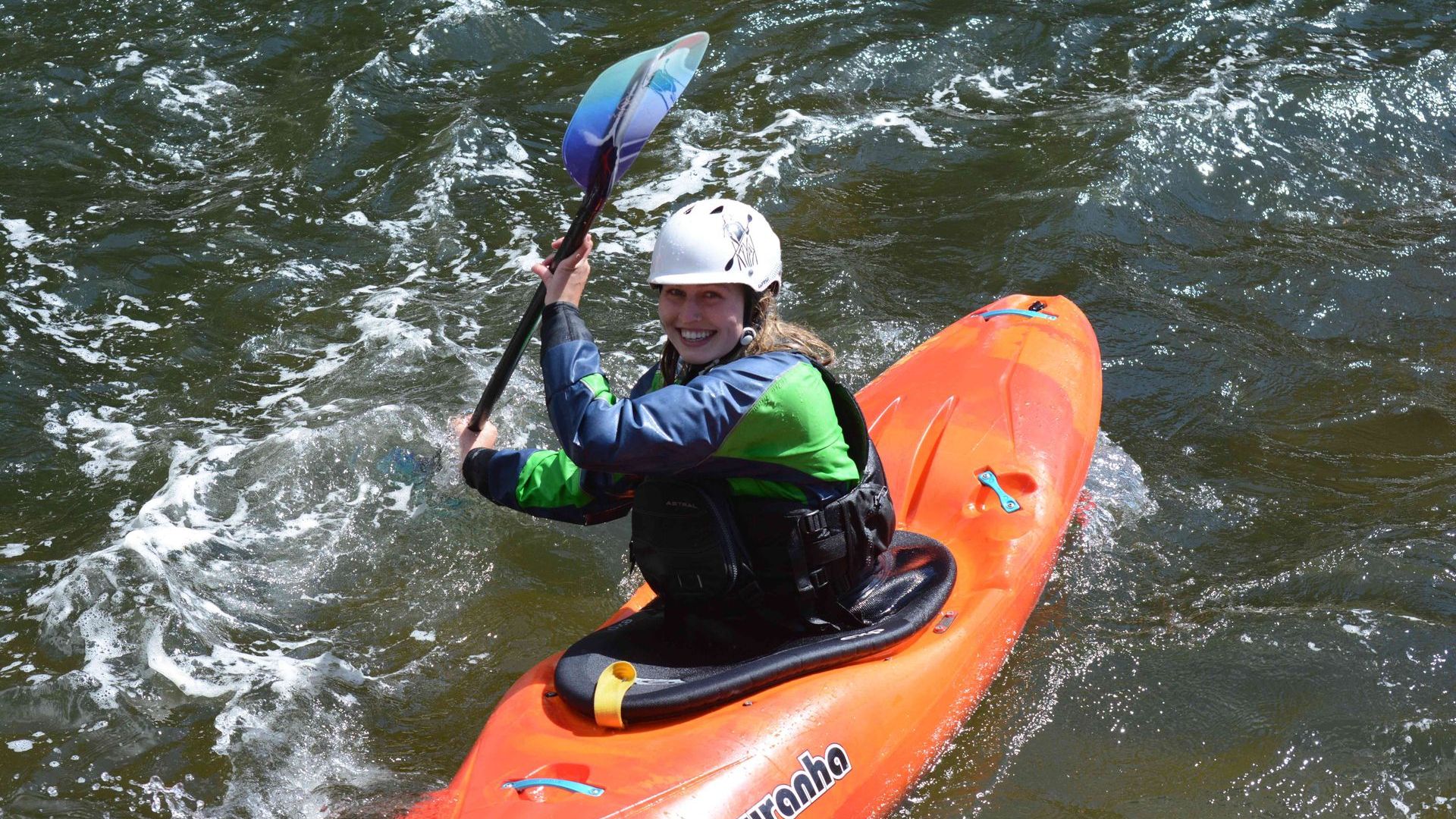 Kids learning to whitewater kayak at Cascade Kayak School summer camp on the Payette River