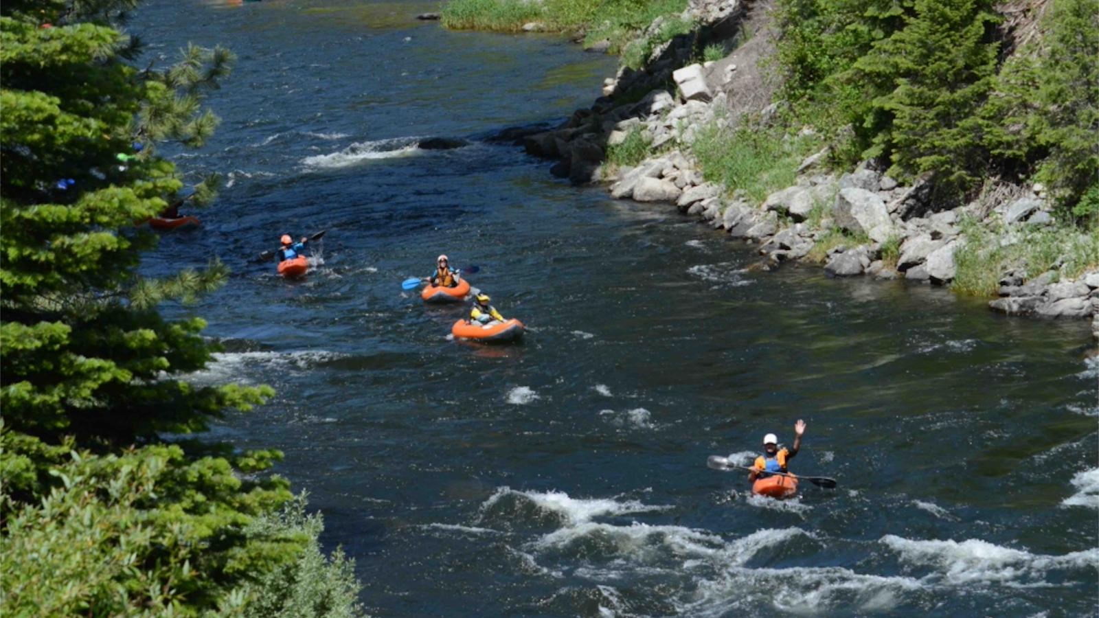 Beginner paddler practicing in an Introduction to Whitewater Kayaking class on the Payette River