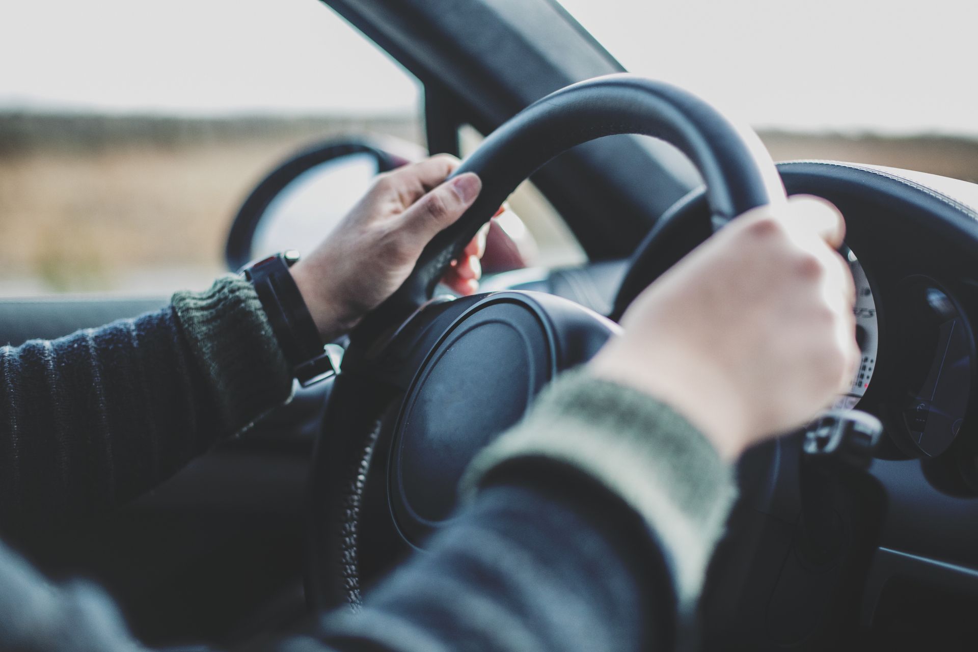 Holding Black Steering Wheel — Bronx, NY — Rivera's Auto Driving School Inc