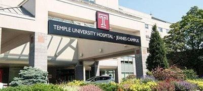 Temple University Hospital–Jeanes Campus entrance with canopy and landscaped bushes