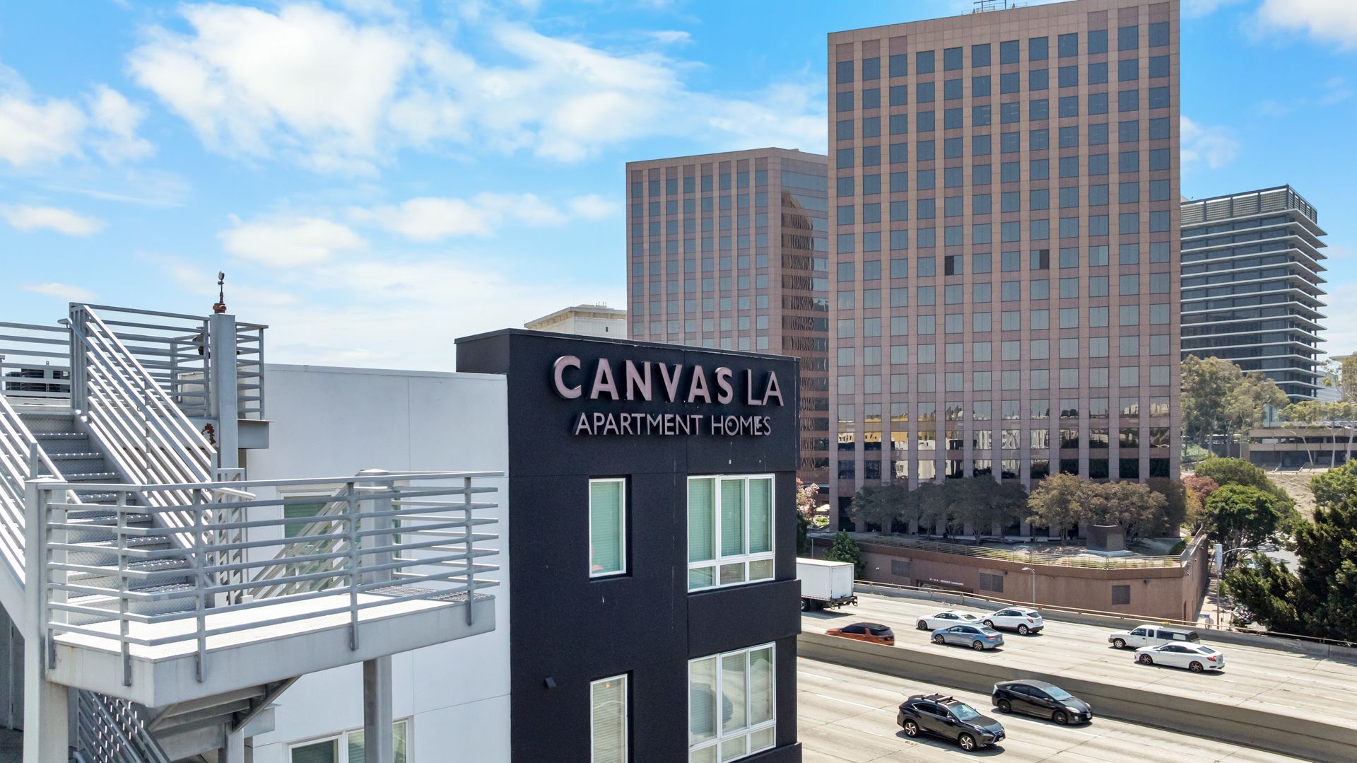 a corner of a building with the name Canvas LA on it