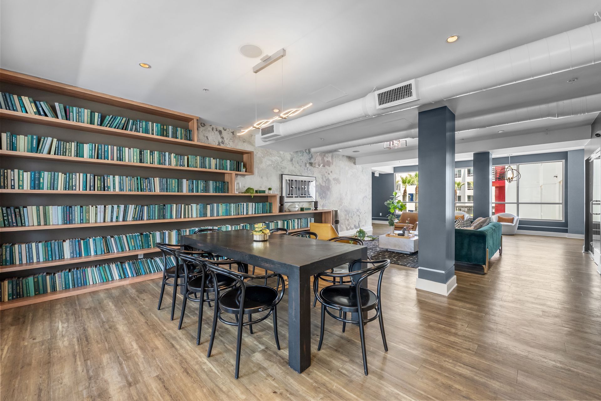 a library with a table and chairs