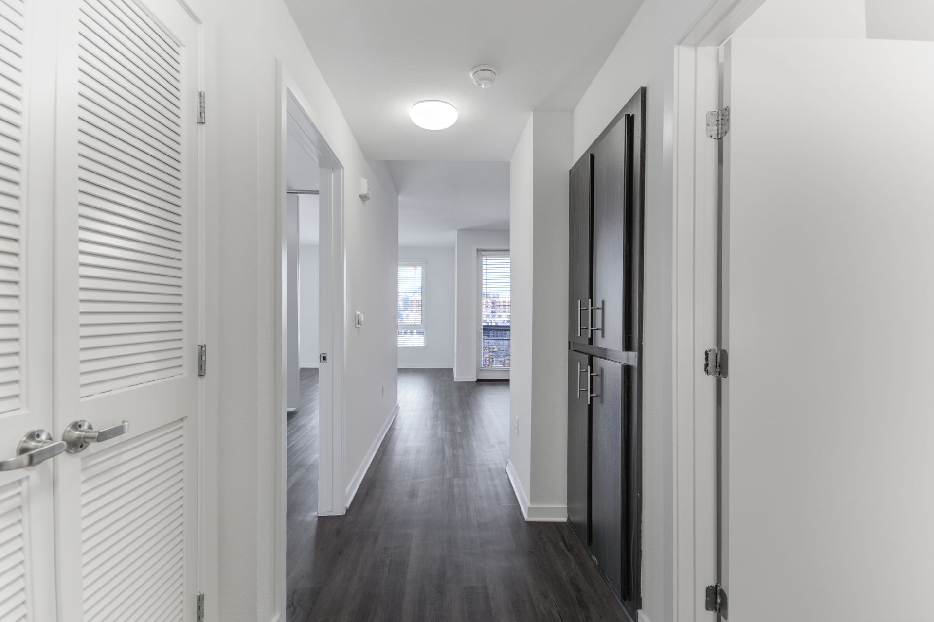 a hallways with doors on either side