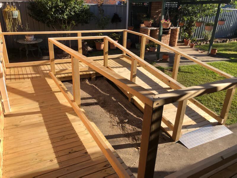 Wooden Ramp With Railings Built Onto a Wooden Deck — Alcando Renovations and Maintenance In Forster, NSW